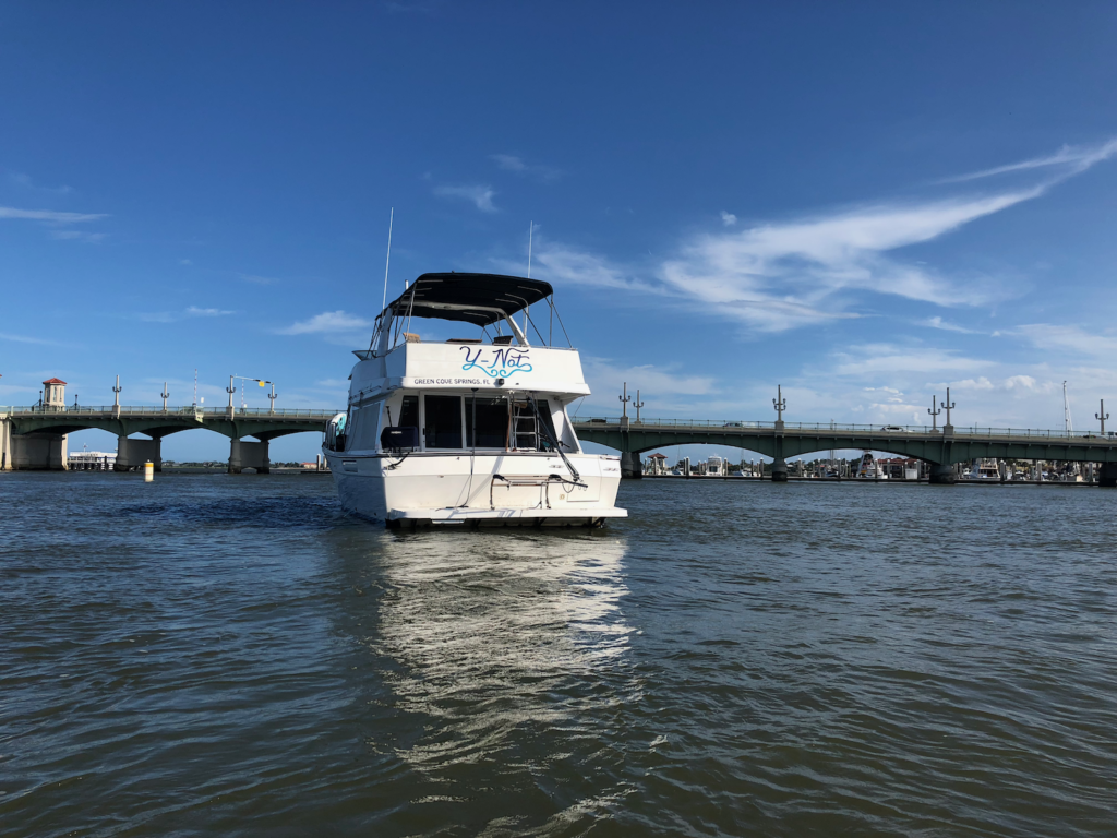 Boat approaching a bridge